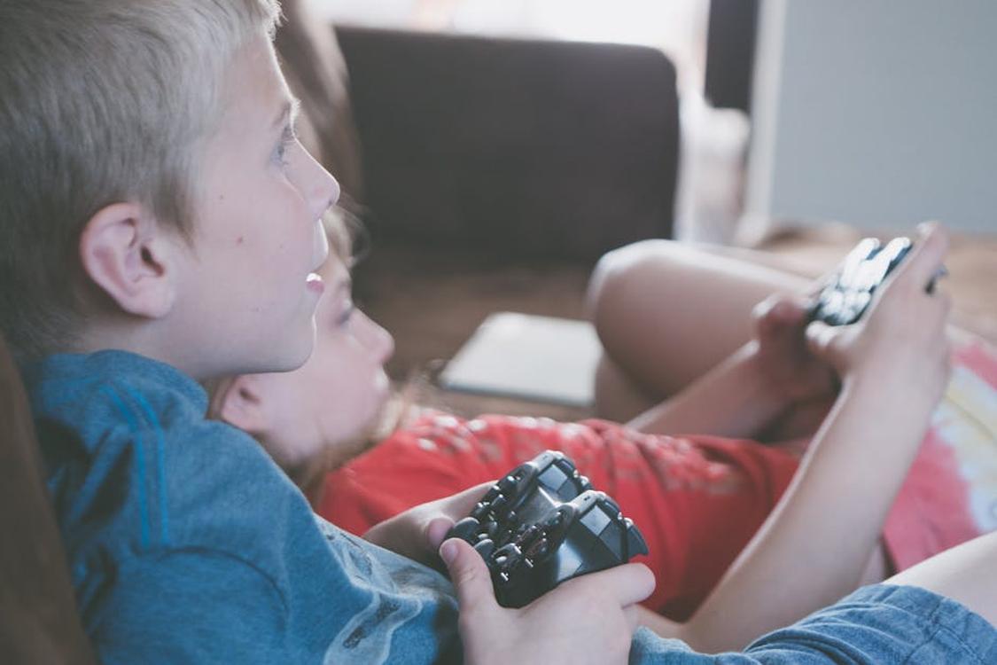 kids playing video games - Cross-Play Servers: Uniting or Dividing the Community?