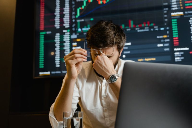 a man holding his glasses 800x535 - Why Most Fail in Modern Investing and How to Succeed