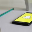 a phone and pencil over a piece of paper 110x110 - 5 Surprising Facts About Snapchat’s 'You May Know' Feature