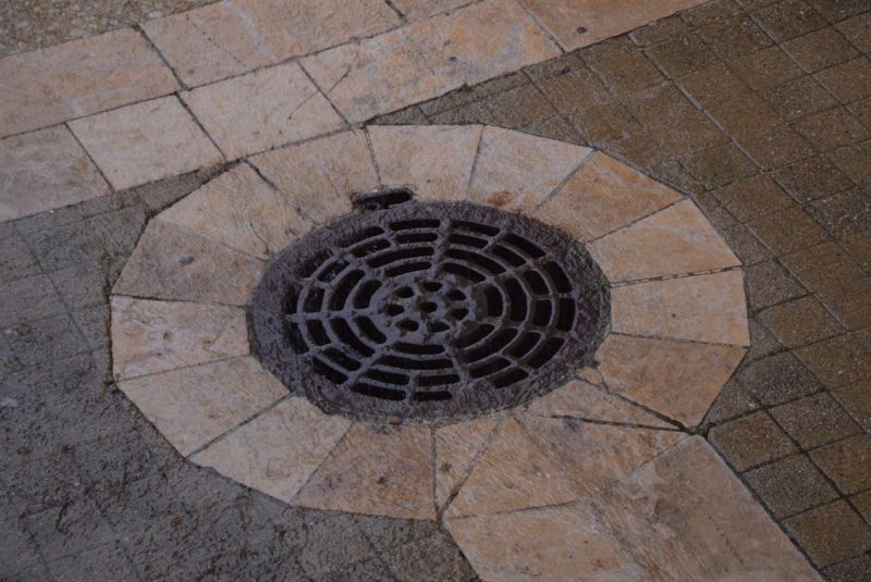 drainage on sidewalk 800x535 - The Science Behind How Drains and Sewer Systems Work
