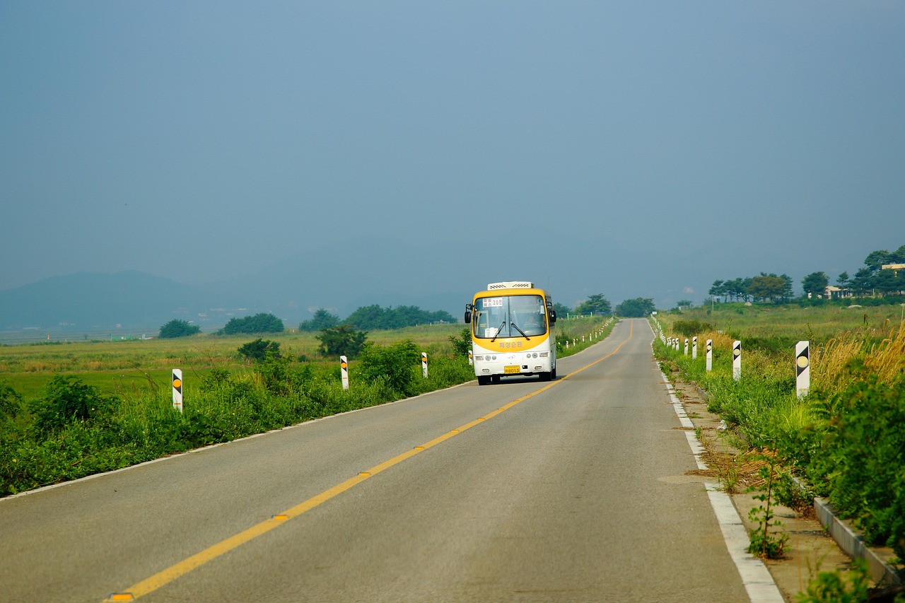 a bus on a wide road - Top 5 Ways to Improve Your Daily Shuttle Bus Ride