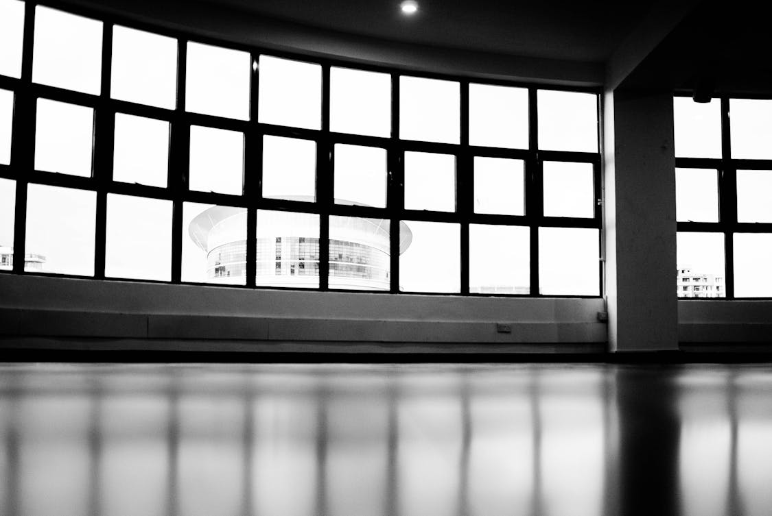 low angle photography of window glass pane - How to Choose the Right Epoxy Flooring for Your Business