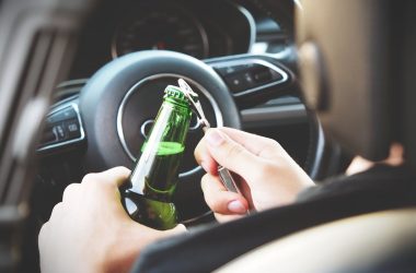 Person Opening Bottle on Car 380x250 - 5 Ways a DUI Lawyer Can Help Reduce Your Penalties