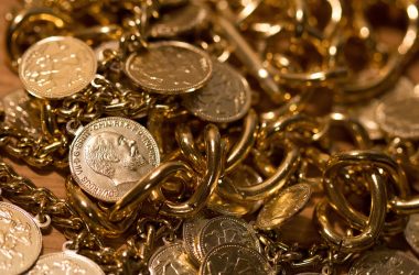 silver coins and gold chain 380x250 - What Makes Silver a Hidden Investment Gem? Explained