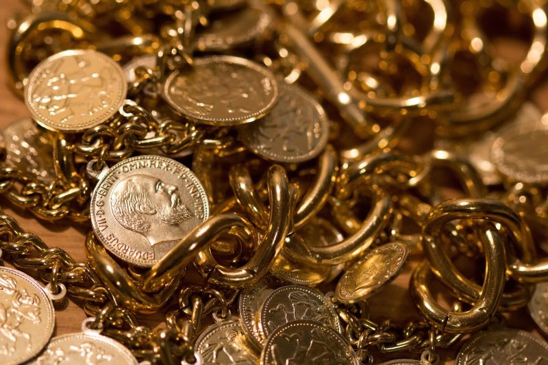 silver coins and gold chain 800x533 - What Makes Silver a Hidden Investment Gem? Explained