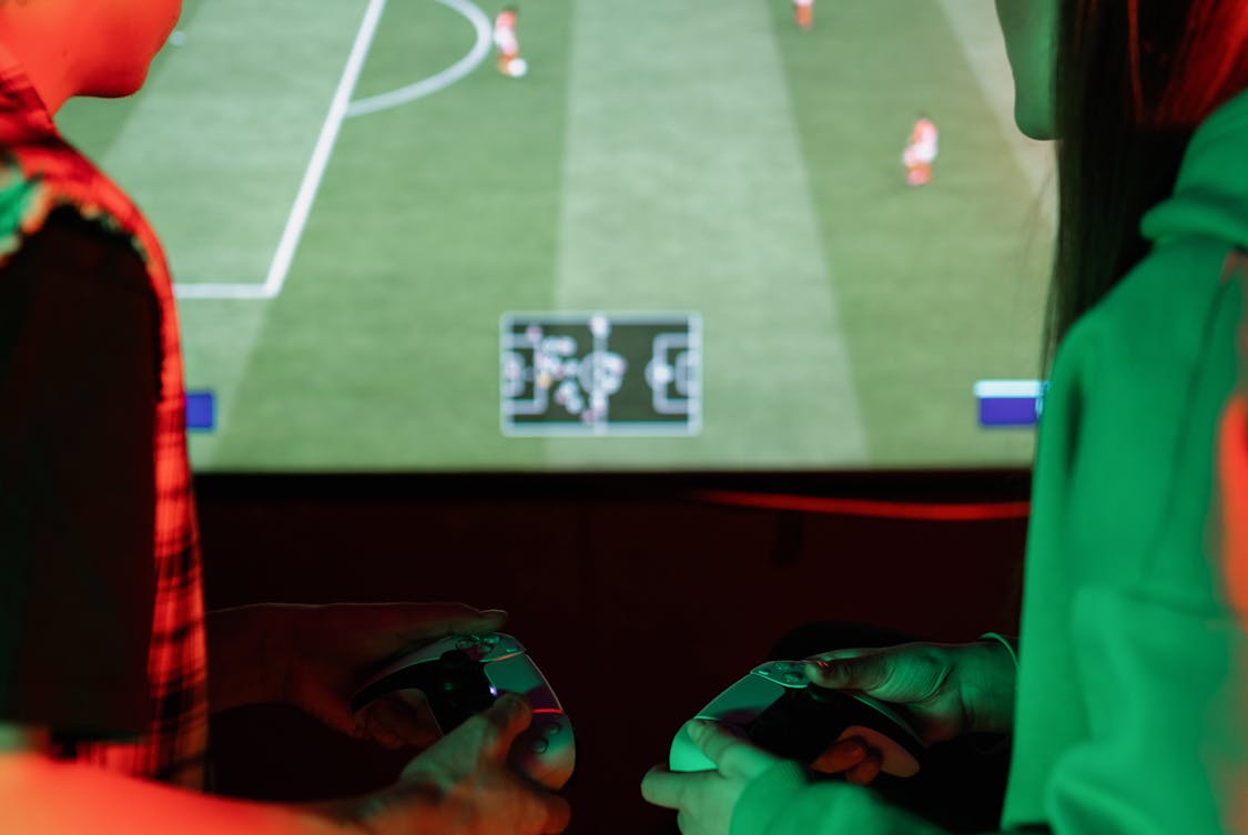 a boy and girl playing a video game - Is FC 26 Career Mode Finally Realistic Enough? Discover