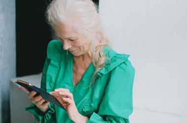 A Woman using a Smartphone 380x250 - Are Senior Phone Plans Worth the Switch? Explained