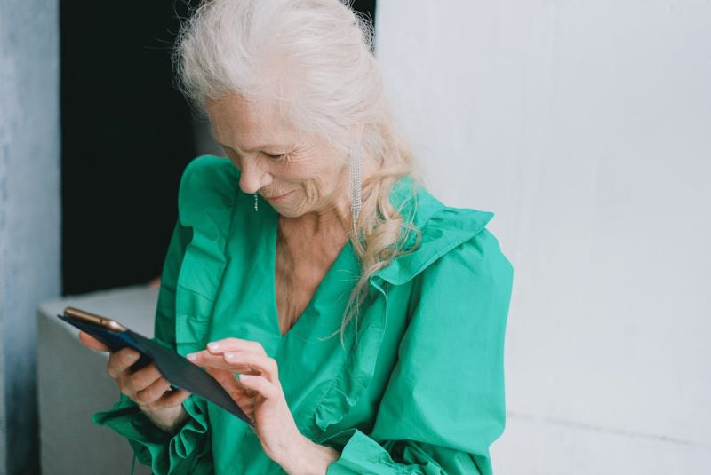 A Woman using a Smartphone 800x535 - Are Senior Phone Plans Worth the Switch? Explained
