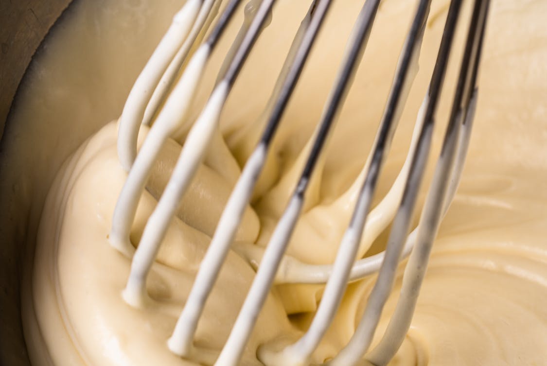 Close up of Creamy Cake Batter Being Whisked - 5 Simple Maintenance Steps for Better Waffle Quality