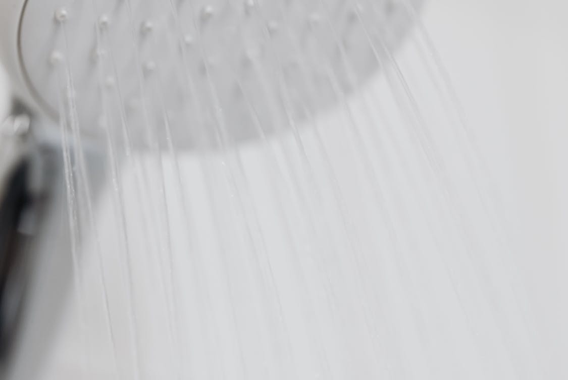 5 Benefits of Installing Off Peak Hot Water Storage close up of white showerhead - 5 Benefits of Installing Off Peak Hot Water Storage