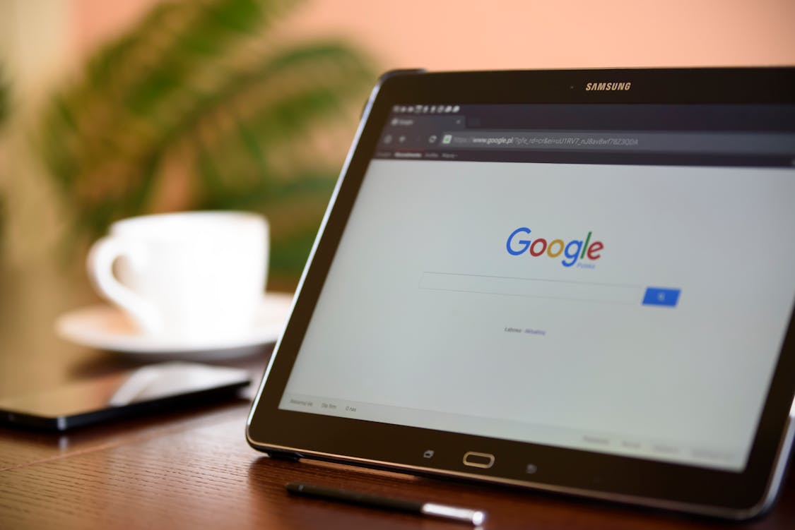 5 Reasons Shopify Stores Are Adopting AI SEO Automation google site shown on a tablet screen - 5 Reasons Shopify Stores Are Adopting AI SEO Automation
