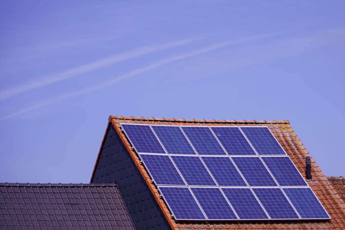 Why Queensland's Solar Record Is Quietly Driving Brisbane Roof and Panel Cleaning Close up of solar panels on a tiled rooftop - Why Queensland's Solar Record Is Quietly Driving Brisbane Roof and Panel Cleaning