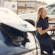 a woman charging her electric car 110x110 - Used Electric Cars Jumped 32% in Three Months, and Families Are Driving Most of It